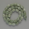 Намистини от жадеит – естествен камък, галтовирана форма 7х11 мм ±, дължина около 38 см ±, на конец