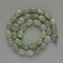 Намистини от жадеит – естествен камък, галтовирана форма 7х11 мм ±, дължина около 38 см ±, на конец