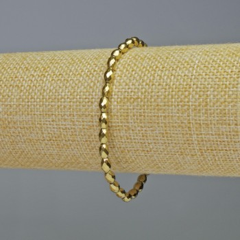 Браслет от гранен гематит, овални мъниста в златист цвят, диаметър 4×6 мм ±, дължина 18 см ±, еластична основа