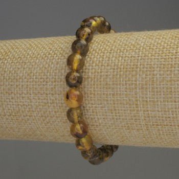 Изискан браслет от янтарни гладки мънисти, диаметър около 8 мм, дължина около 18 см, еластична основа