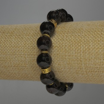 Гривна от гранат с гладка мъниста, диаметър около 12 мм, с метални вложки, дължина 18 см, еластична основа