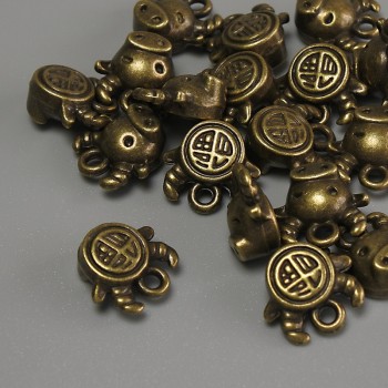 Висулка Бик бронзов цвят, размери 10×9×5 мм, диаметър на отвора около 1 мм, опаковка 20 г (~17 бр.)