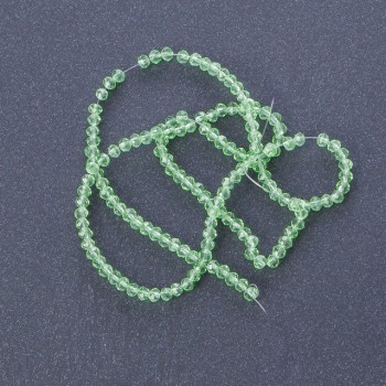 Мънисти от чешки кристал прозрачен светло-зелен цвят, дължина 37 см, диаметър 3–4 мм