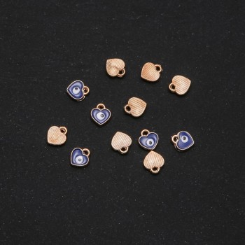 Фурнитура: висулка сърце „очи“ емайл 7×8 мм фас. 12 бр.