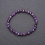 Браслет от естествен аметист на еластична нишка, съставен от гладки мънисти с диаметър около 6 мм, обиколка 18 см