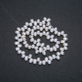 Нитка пресноводни перли, диаметър 6×4 мм, дължина 36 см ± с бензинов отлив