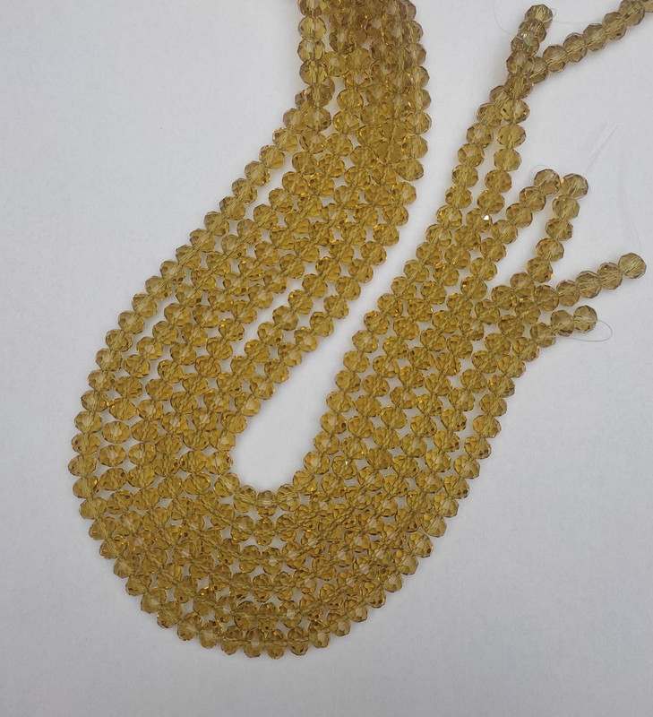 Намистини Чеський Кришталь прозорий шампань гранований рондель, діаметр 8х6мм+-, довжина 40мм+- на волосіні