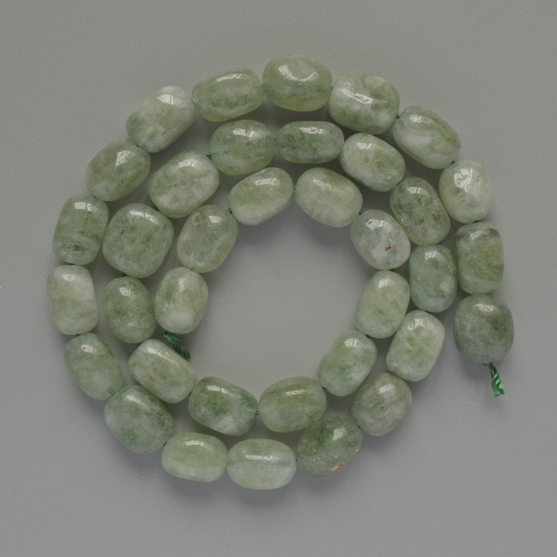 Намистини от жадеит – естествен камък, галтовирана форма 7х11 мм ±, дължина около 38 см ±, на конец