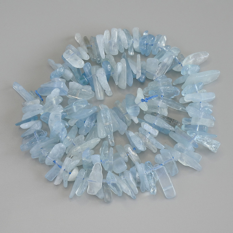 Аквамаринови мъниста ситно зърно, диаметър 10-15×2-4 мм, на конец, дължина 42 см