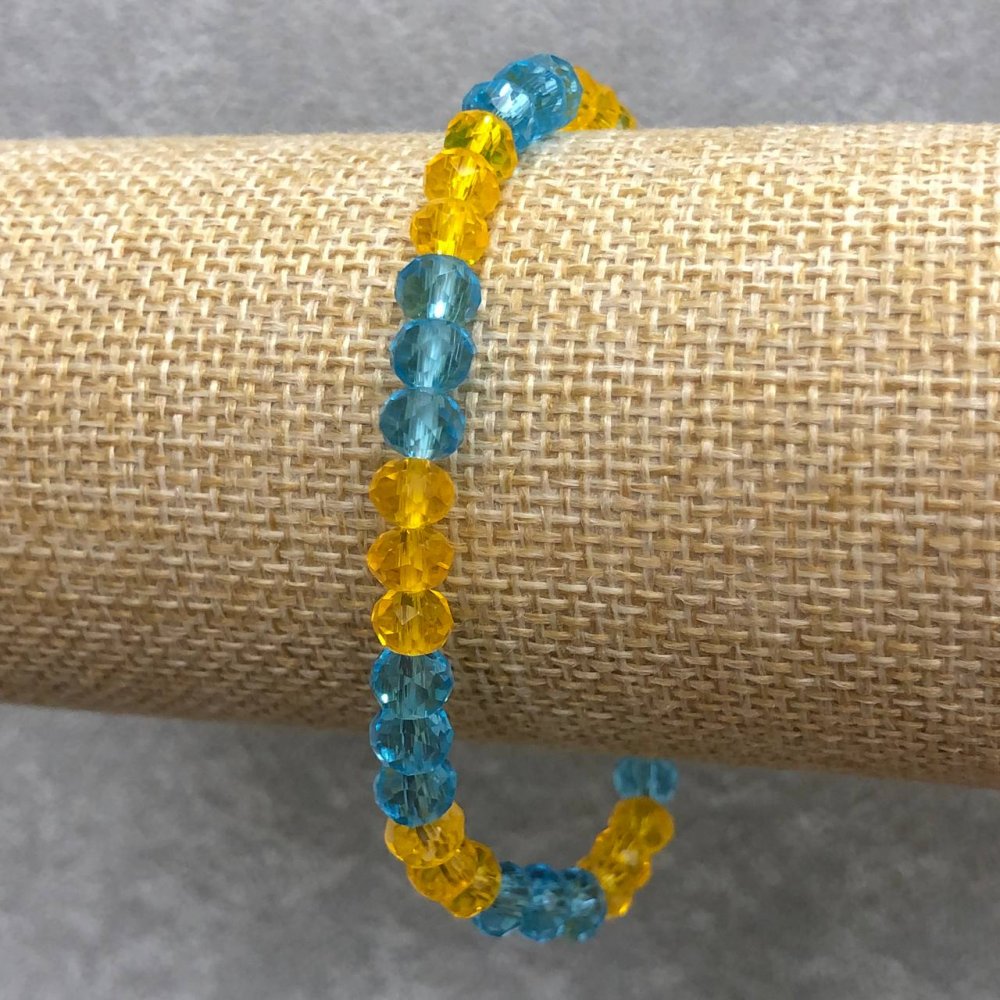 Гривна на ластик от чешки кристал Украйна — гранован рандел, диаметър 6×4 мм, дължина 18 см ±